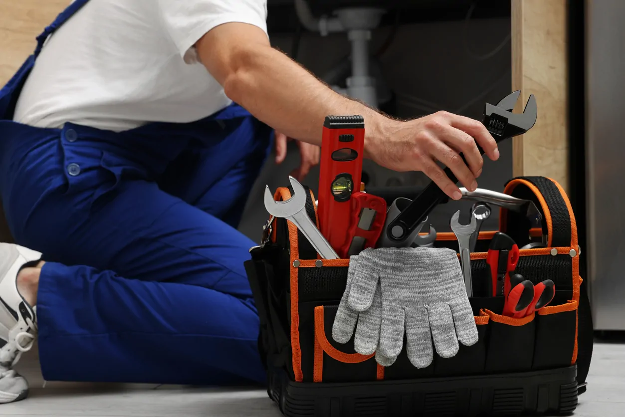 Certified plumber fixing commercial pipes